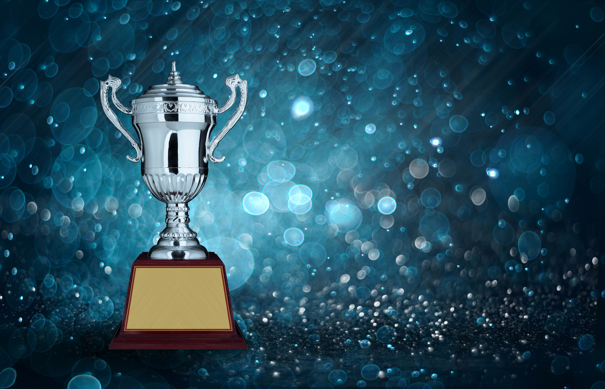 abstract silver trophies with blue bokeh lighting. copy space re