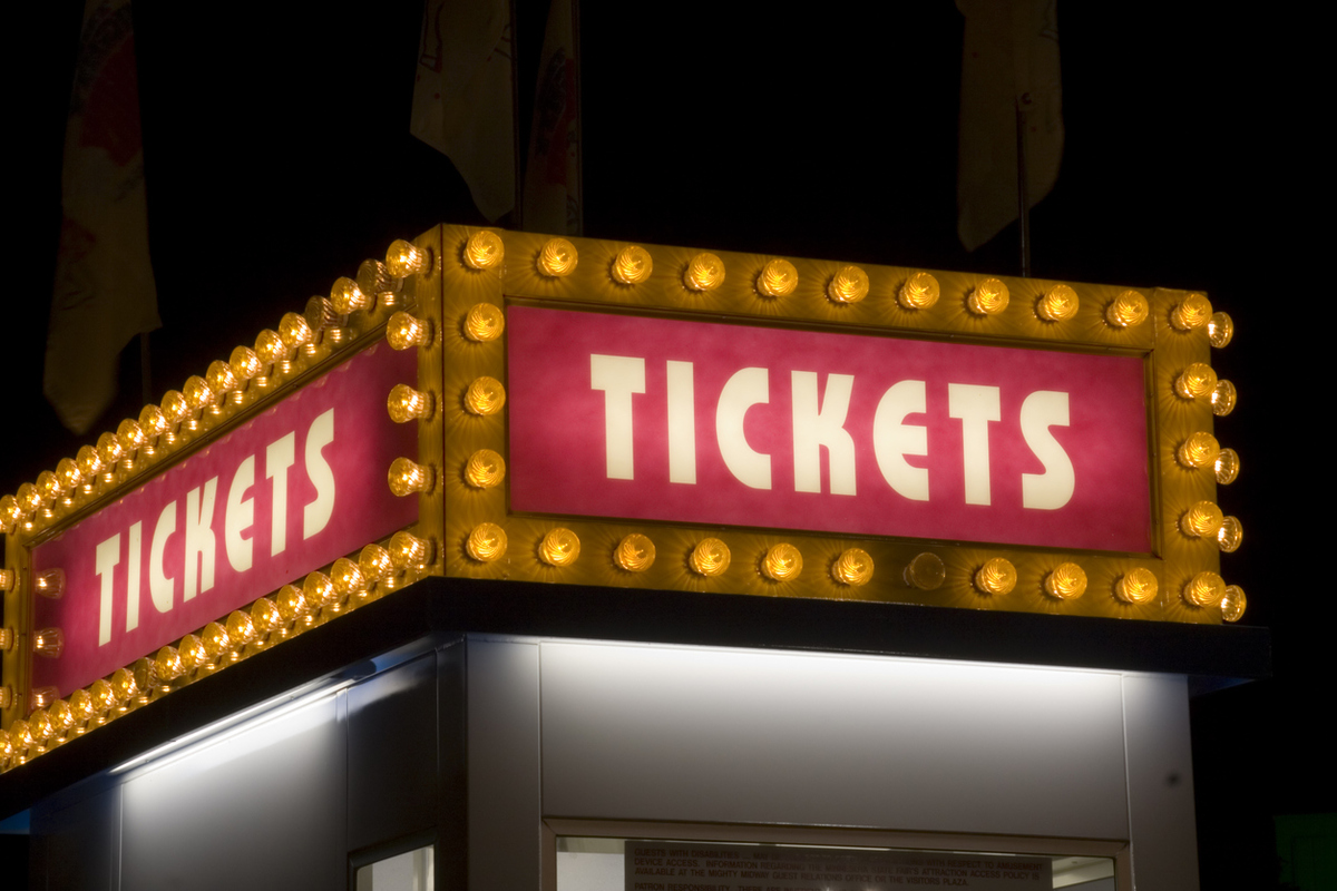 Movie Theater and Carnival Ticket Sign Lit up with Light