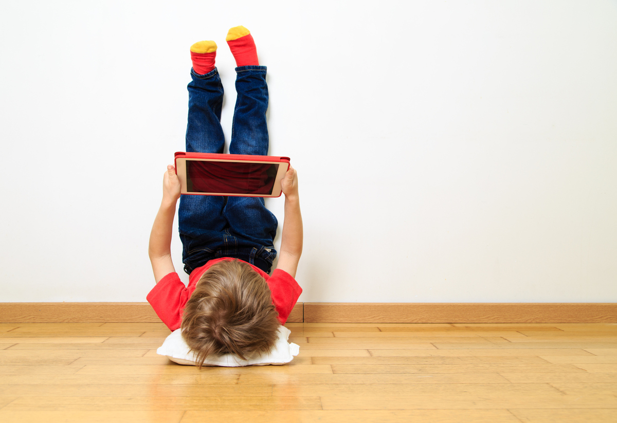 Child using Ipad|teenager lay on the floor in the room